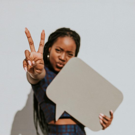Woman doing a peace sign
