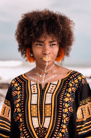 Young beautiful African woman, wearing African print design clothes